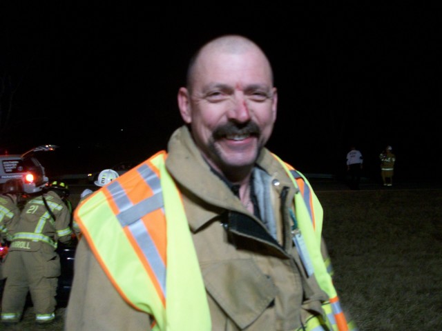 Firefighter Mike Nelson is all smiles after a close encounter with a flying traffic cone on Route 1.